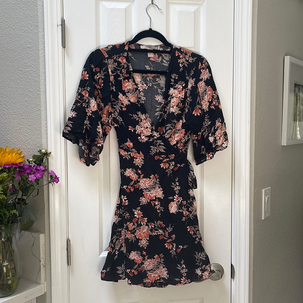 Black floral print wrap sundress with tie at natural waist. Flattering and cute!